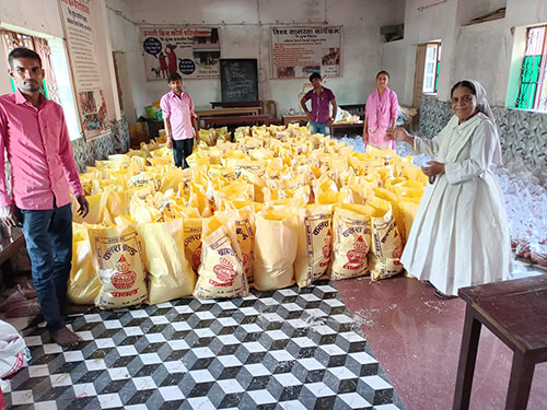 Sr. Crescence and her team prepare food packets
