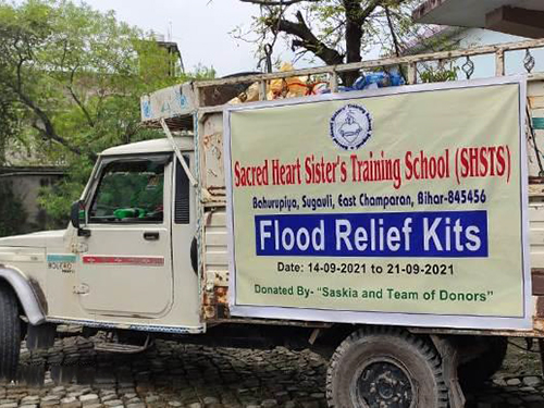 Sr. Ambrose distributes flood relief kits